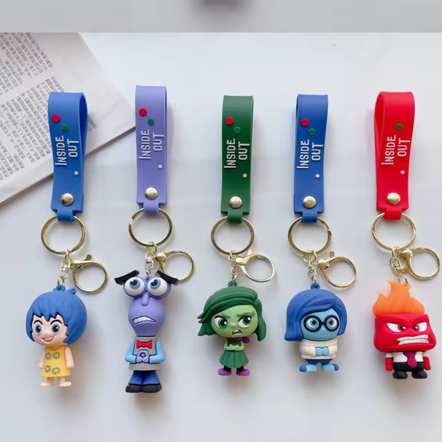 Brighten your keys with an Inside Out Cartoon Keychain featuring Joy, Sadness, Anger, Disgust, and Fear. Perfect for fans, this colorful and detailed keychain adds a playful touch to keys, bags, or backpacks. Great as a gift or personal accessory.
